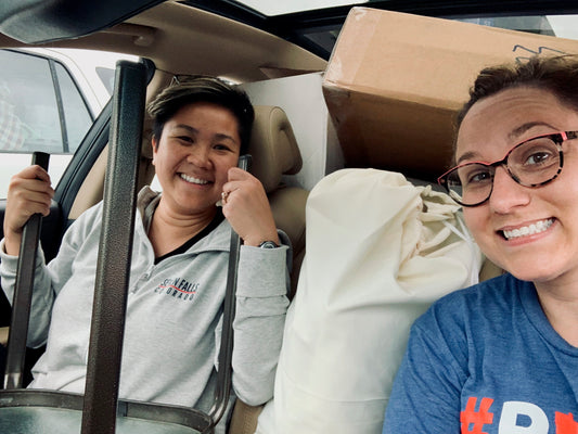 Jamie and Souphak packing up after a Pride event