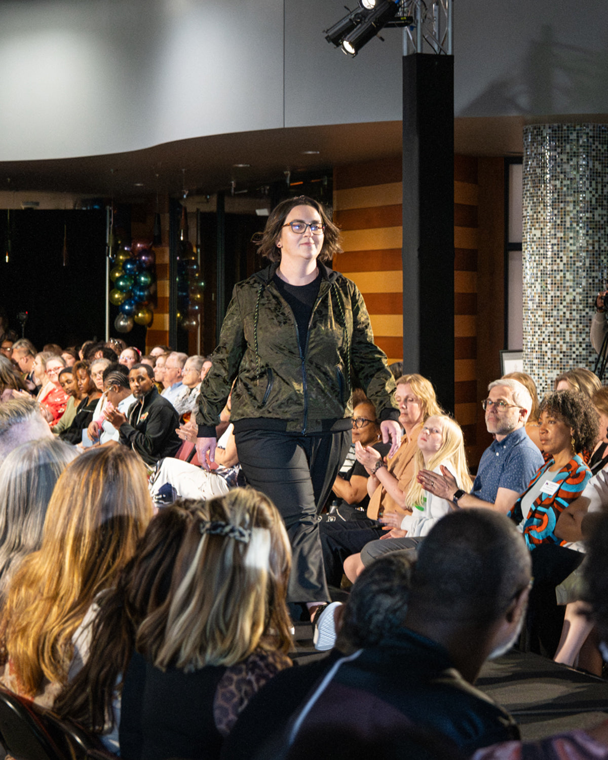 Model wearing the original Jay Victoria bomber jacket on the runway.